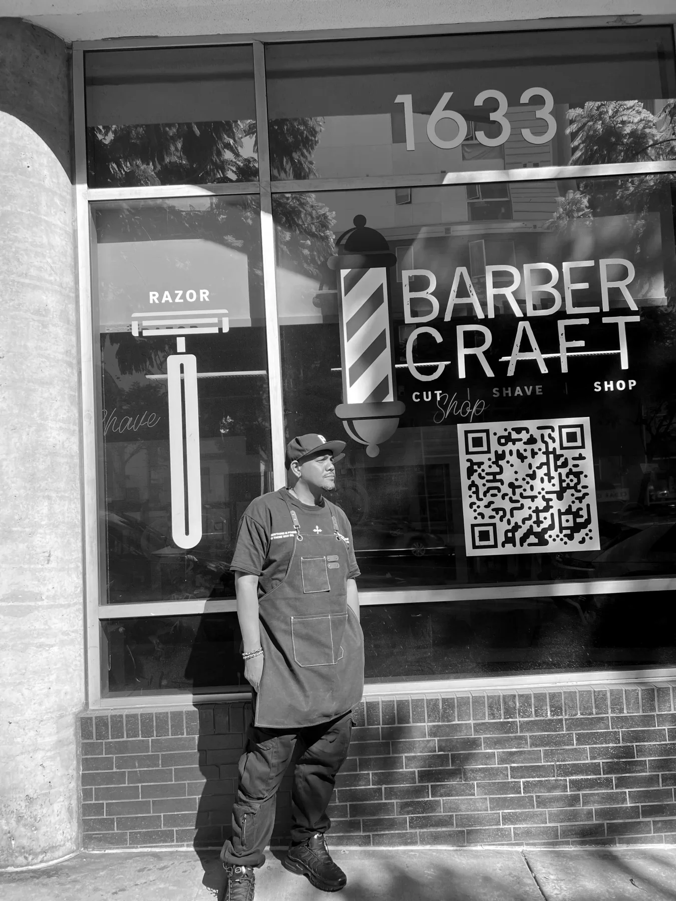 Jonathan standing outside the Barbercraft shop in San Diego